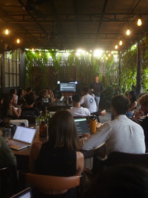 A packed evening event at a garden venue